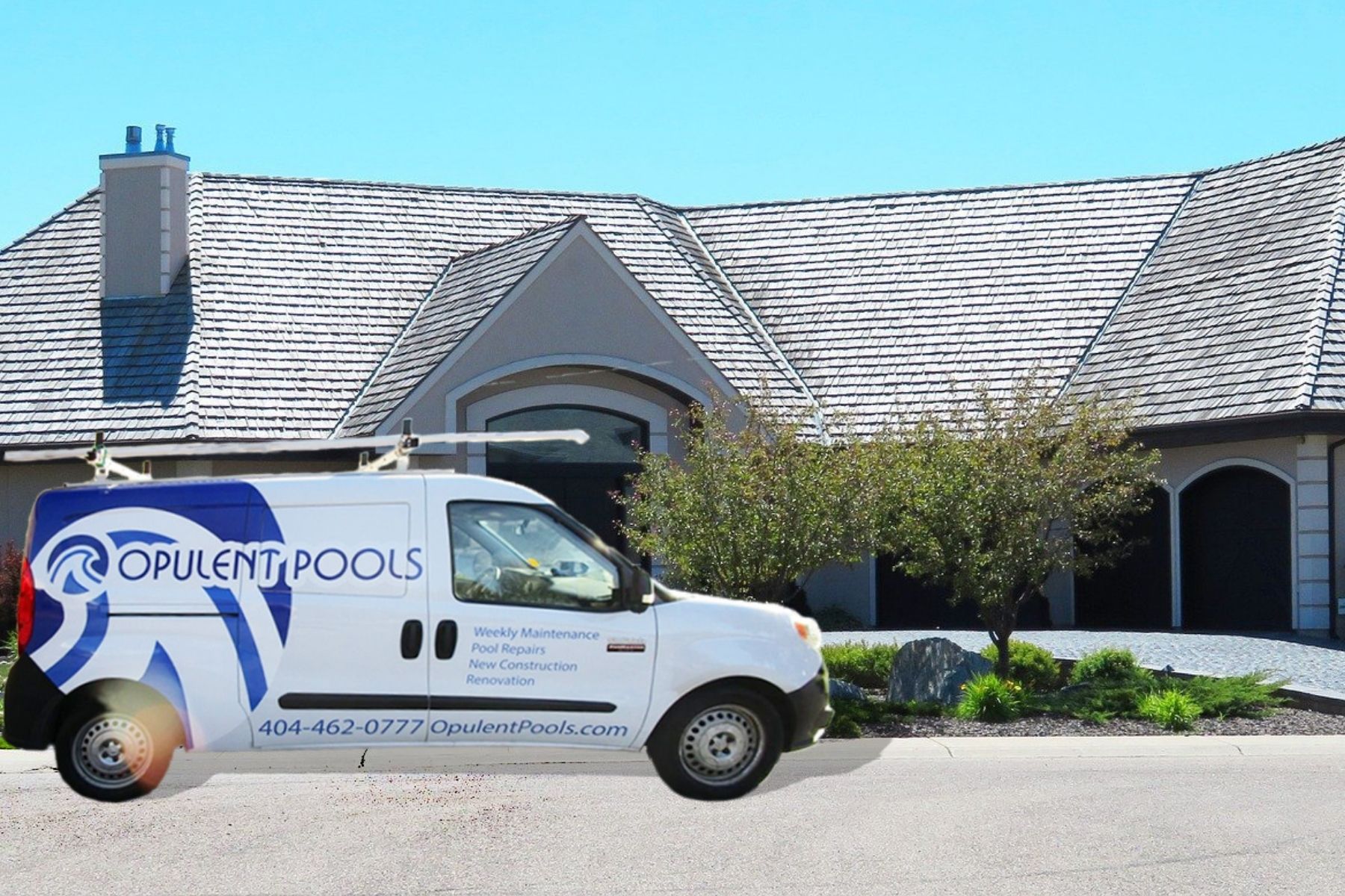 Business truck in front of large house