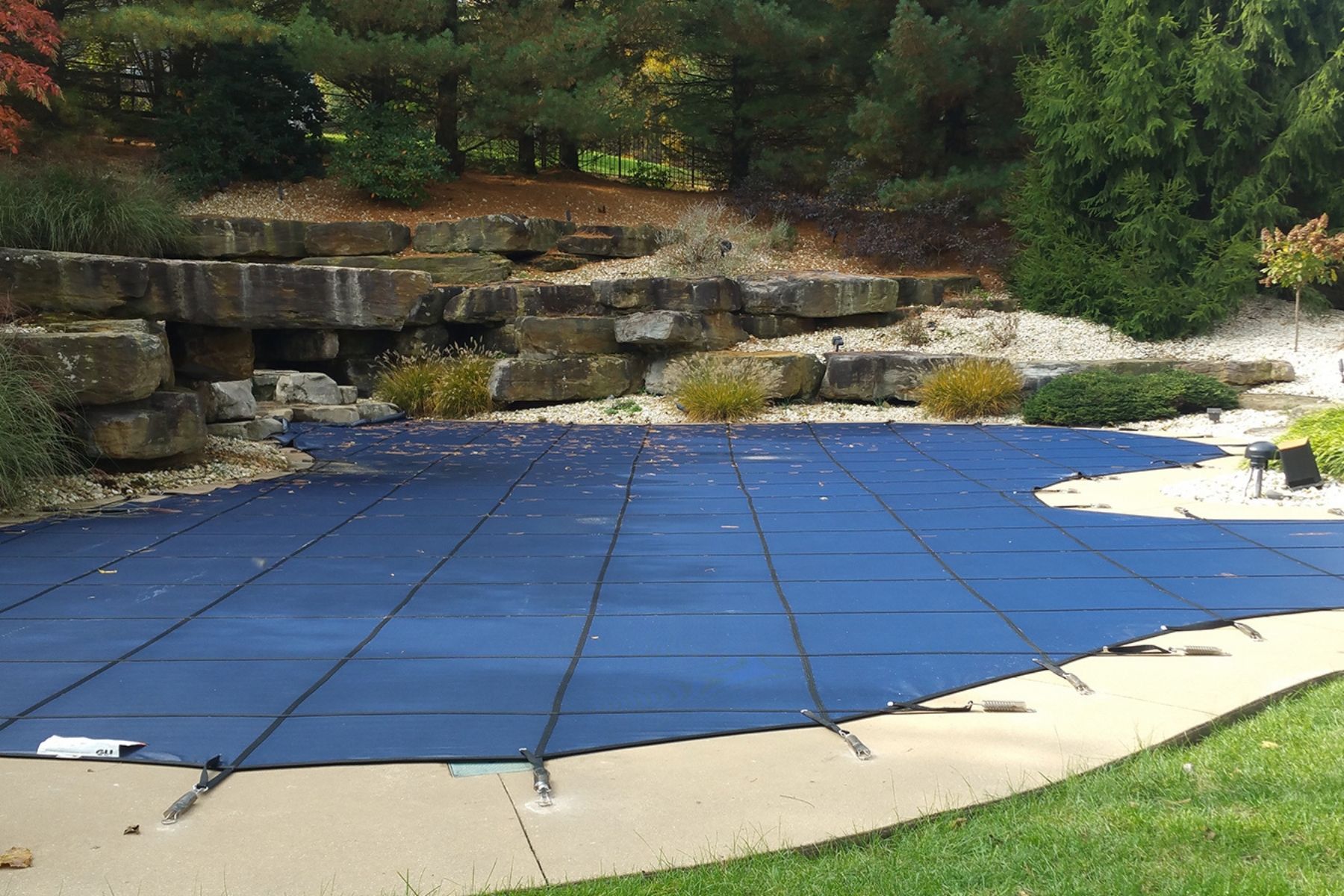 Pool Safety Cover covering the entire shape of the pool